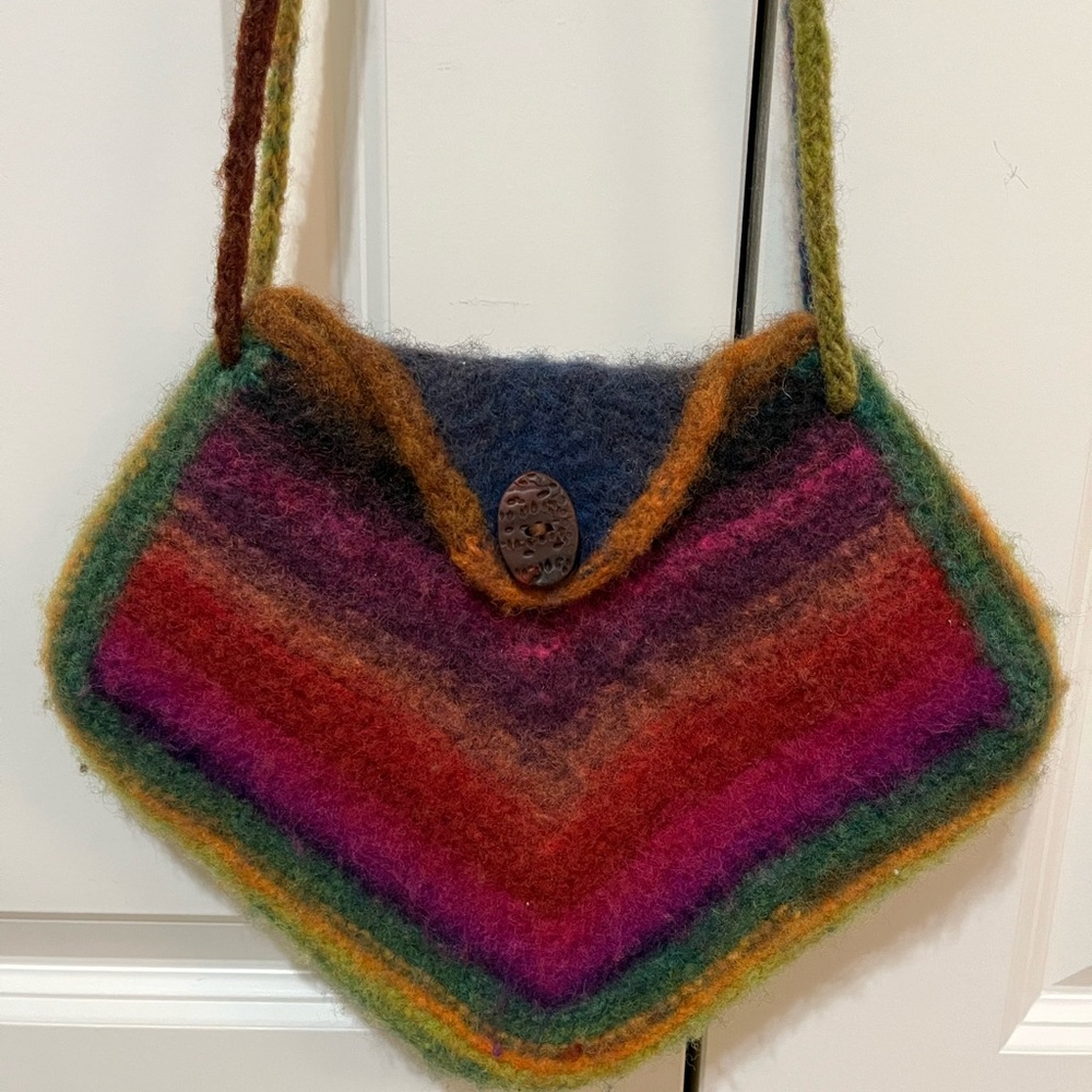 Handmade purse %100 wool felt mitered knitted purse. 9”x9” front button closure.